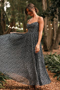 Front view of a black floral maxi dress with a sweetheart neckline