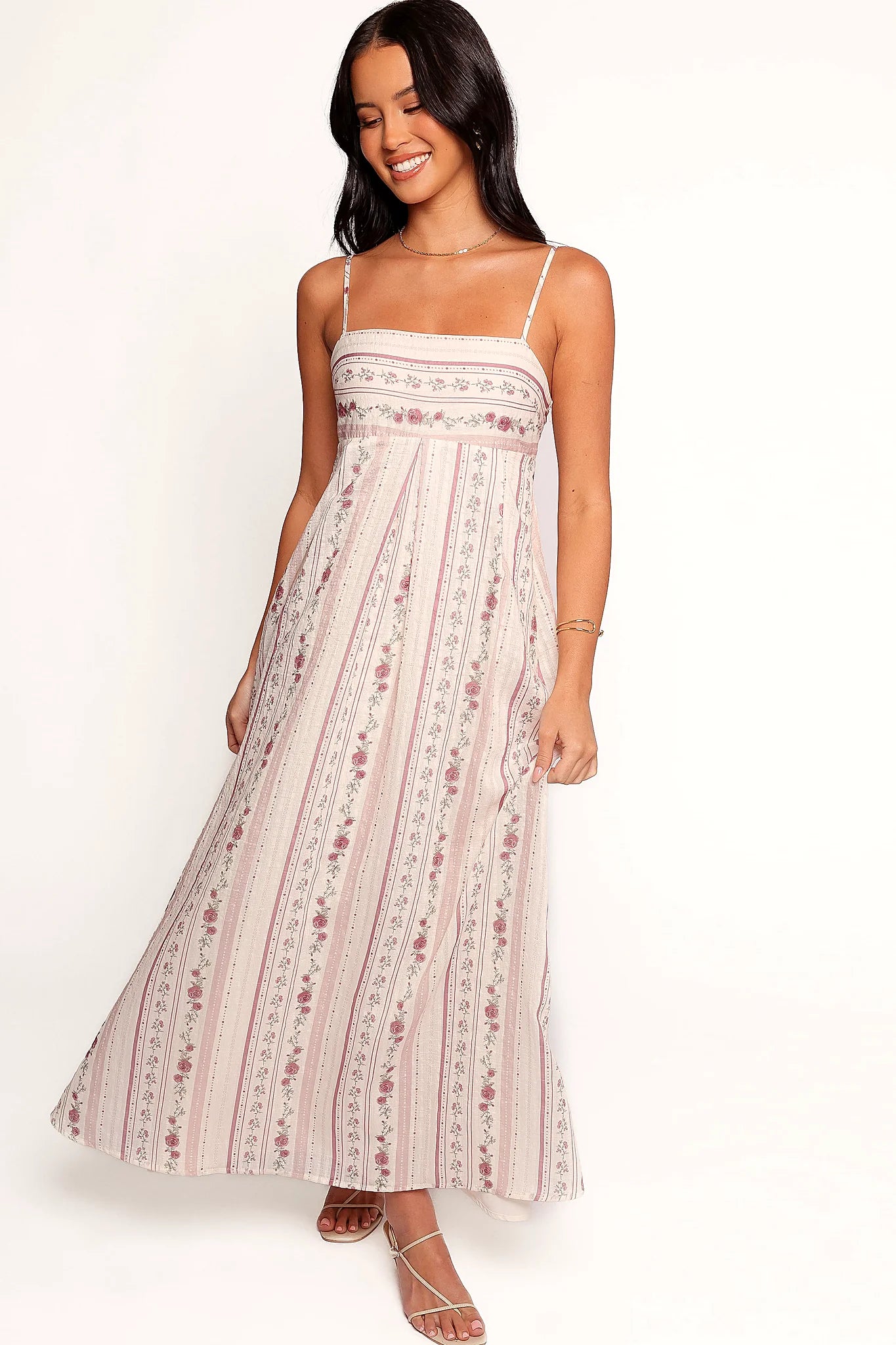 Front view of a floral maxi dress with a square neckline and empire waist