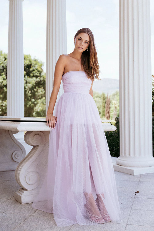 Front view of a pale pink strapless maxi dress in tulle mesh