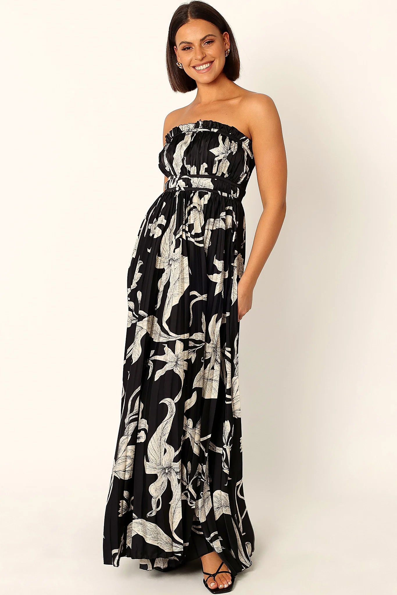 Side view of the pleated skirt falling to the floor