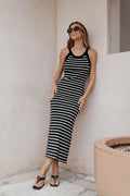 Front view of a black and beige striped knit midi dress