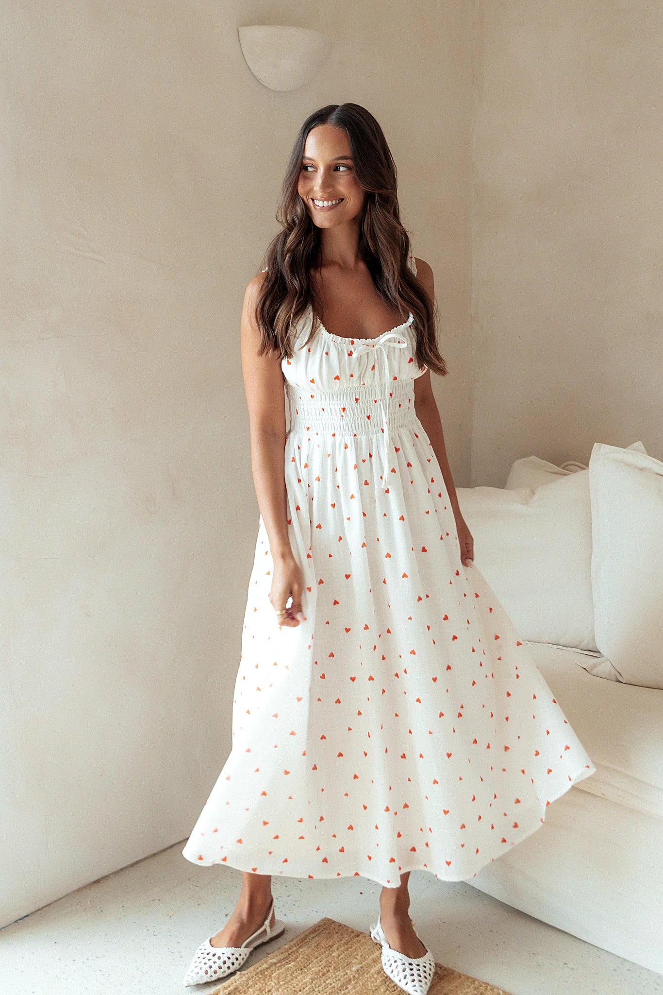 Front view of a heart print cotton midi dress with a bust tie