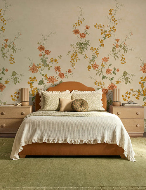 Bedroom at an angle with a botanical cotton sham on the bed