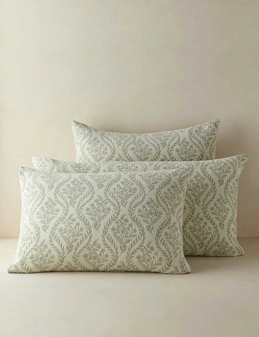Group shot of sage botanical cotton shams in two sizes