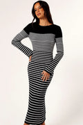 Front view of a black and white striped knit midi dress