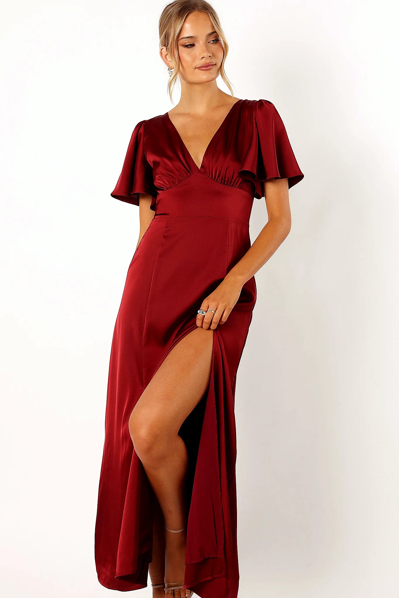 Front view of a wine satin maxi dress with a V neckline