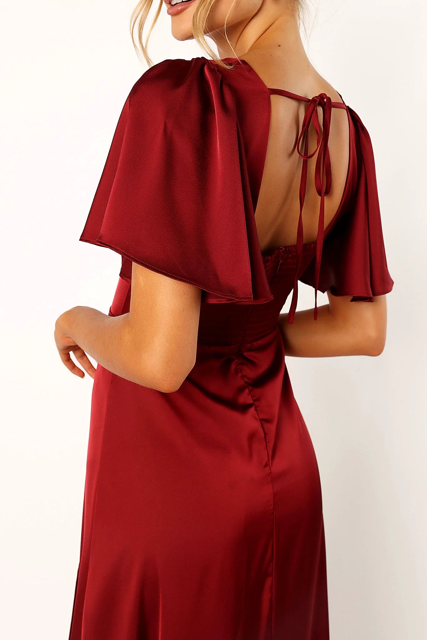Back view showing the shirred panel and tie close