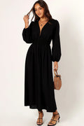 Front view of a black linen maxi dress with a deep V neckline