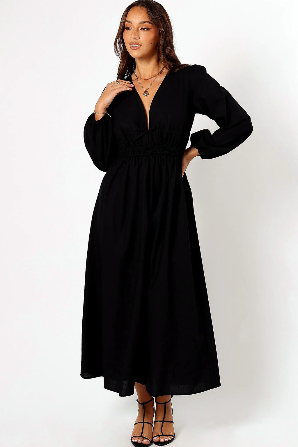 Side view showing the A-line skirt falling to the floor
