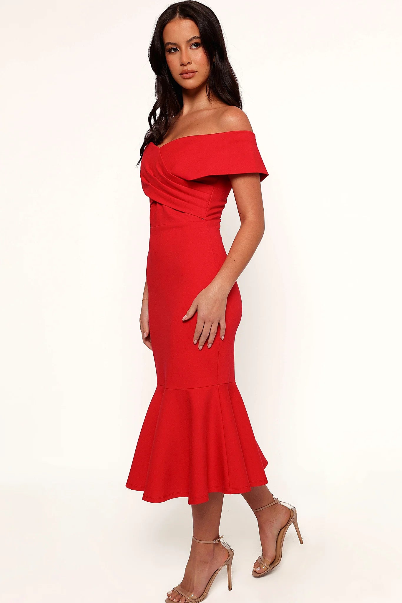 Side view showing the fishtail hem flaring at the bottom