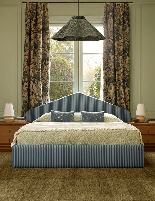 Bedroom with a botanical cotton coverlet spread across the bed