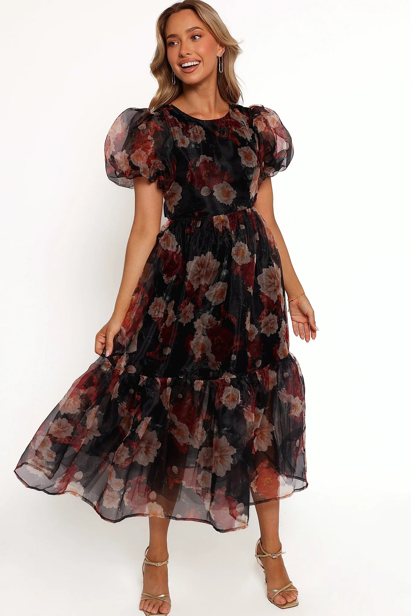 Front view of a black floral midi dress with a high round neckline