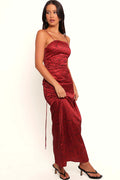 Front view of a red satin midi dress with a black spot print