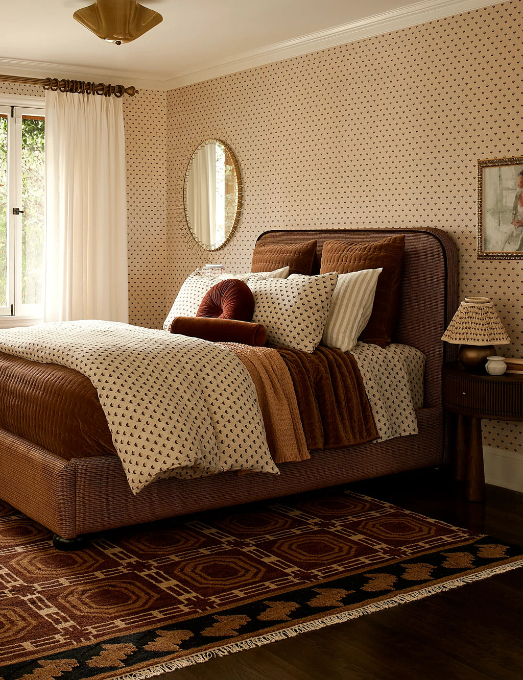 Floral linen sham layered on a bed in a sitting room
