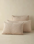 Group shot of floral motif linen shams in several sizes