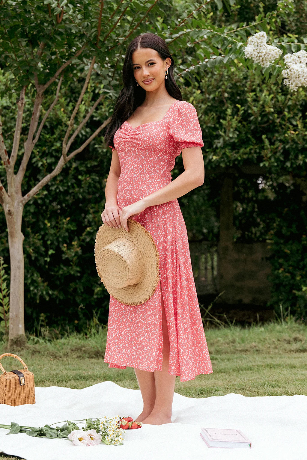 Front view of a red floral midi dress with a sweetheart neckline