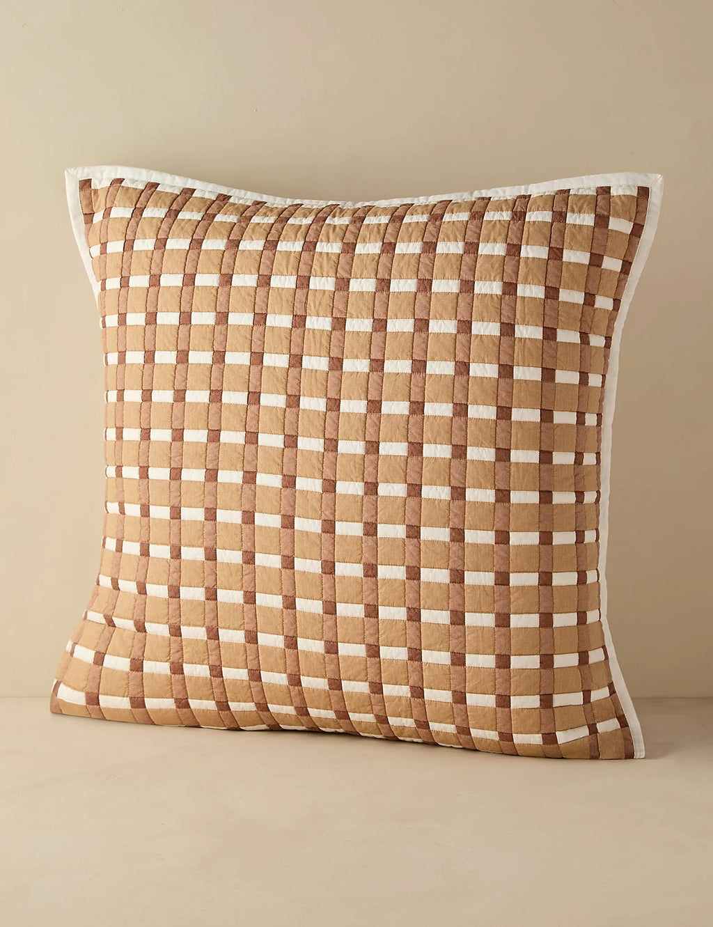 Blush gingham quilted sham in euro size shown against a plain ground