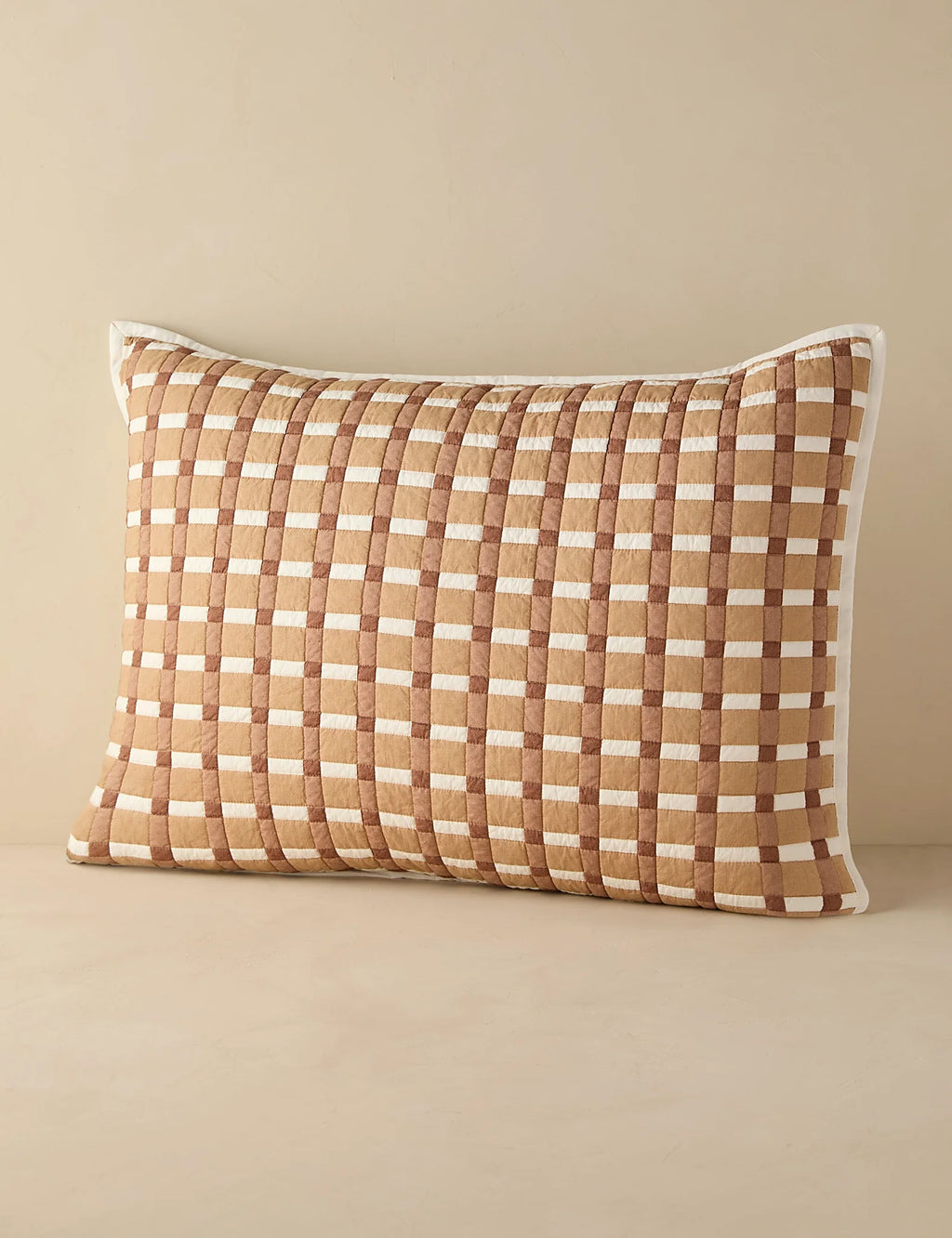 Blush gingham quilted sham in standard size photographed flat