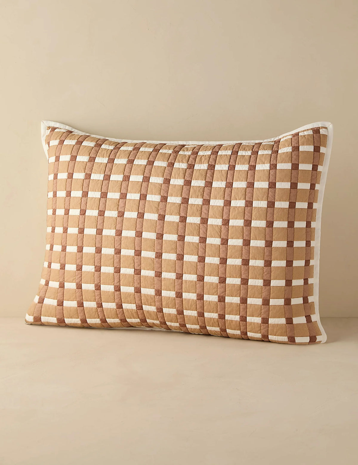 Blush gingham quilted sham in standard size photographed flat