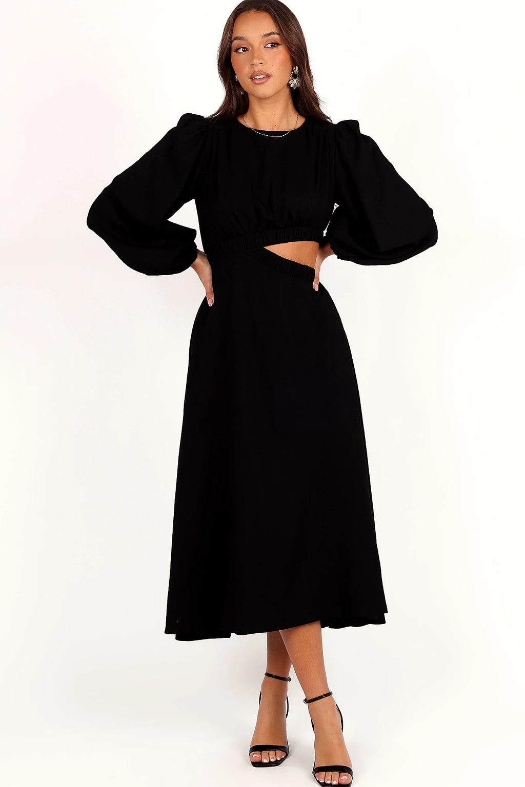 Front view of a black midi dress with a round neckline and cut-out detail
