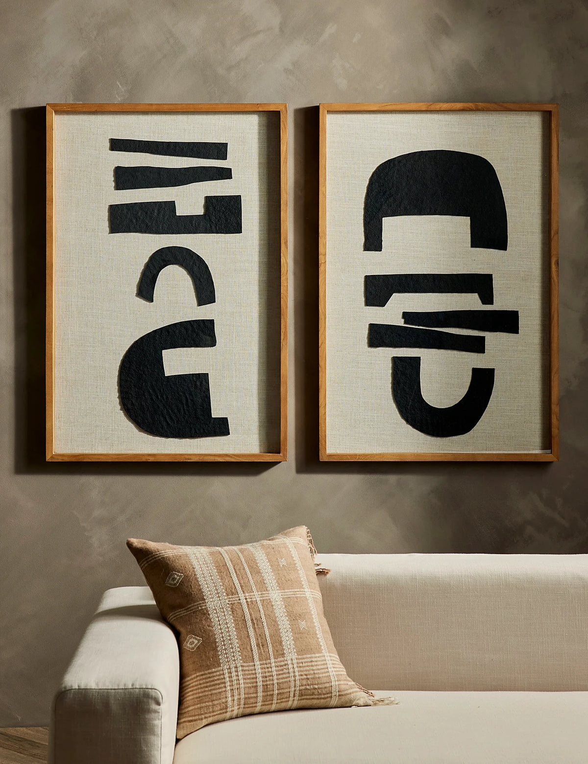 Hand loomed pillow styled beside other decorative cushions
