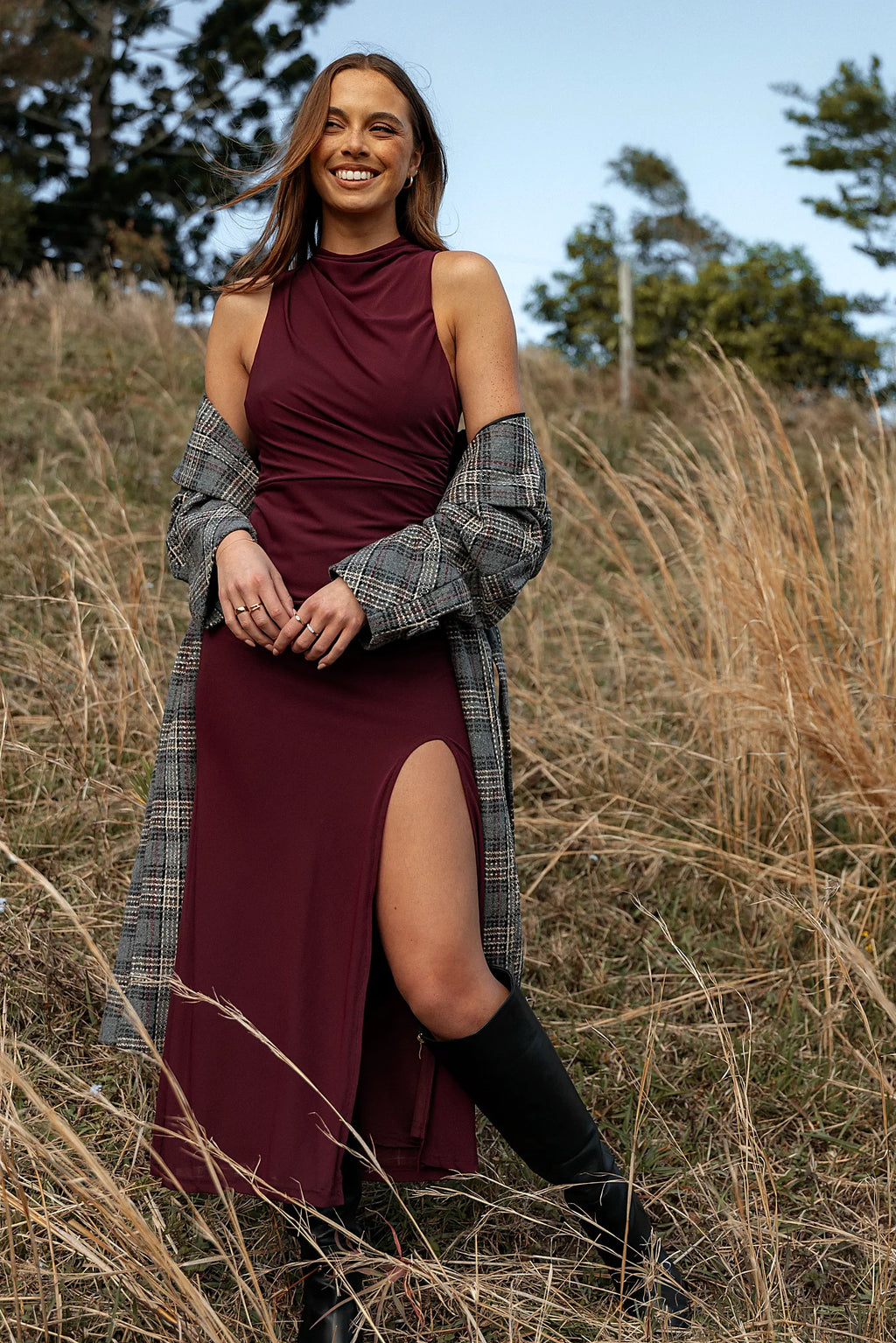 Front view of a sleeveless maxi dress with a high neckline