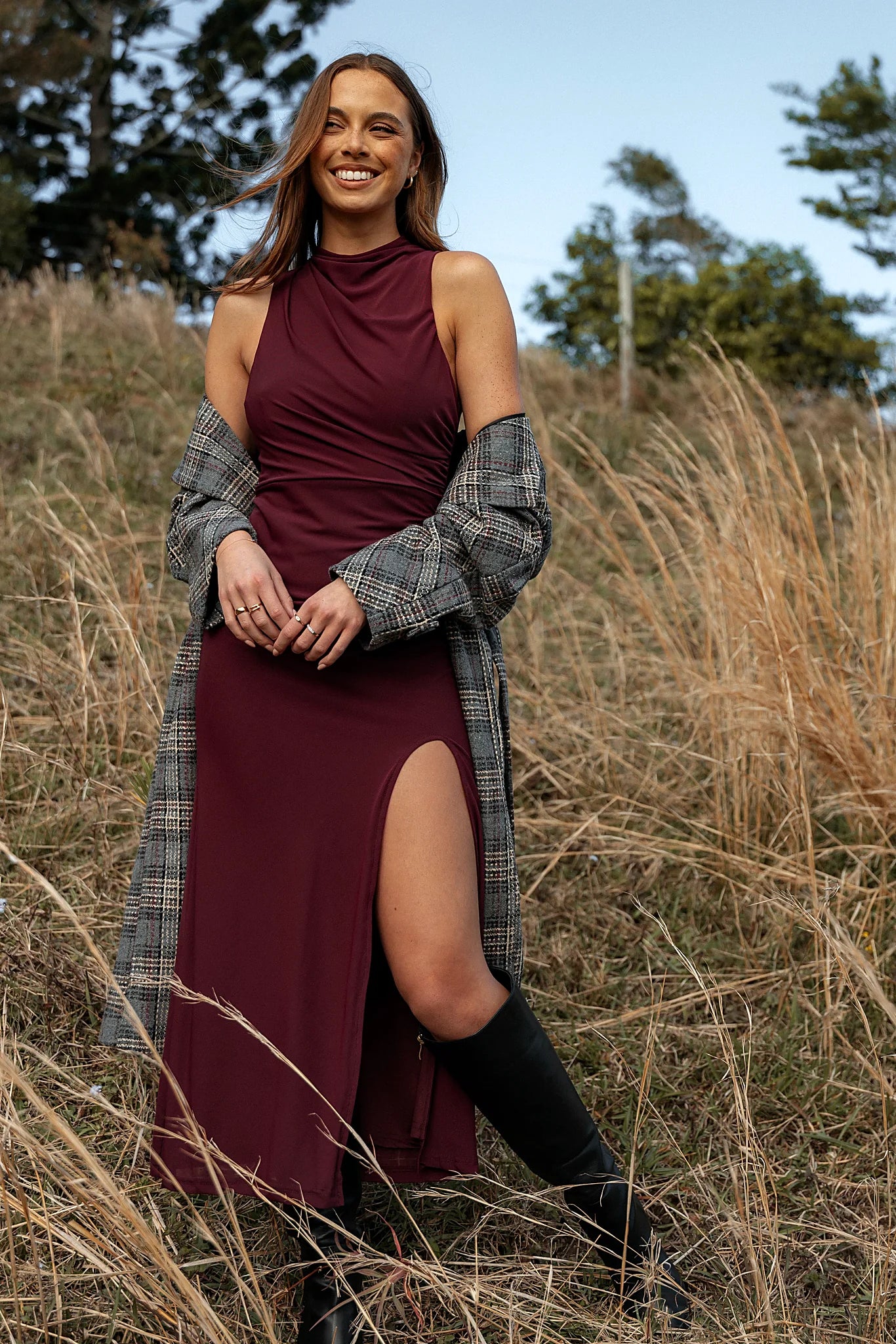 Front view of a sleeveless maxi dress with a high neckline