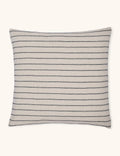Black hemp accent pillow in a square shape against a plain ground