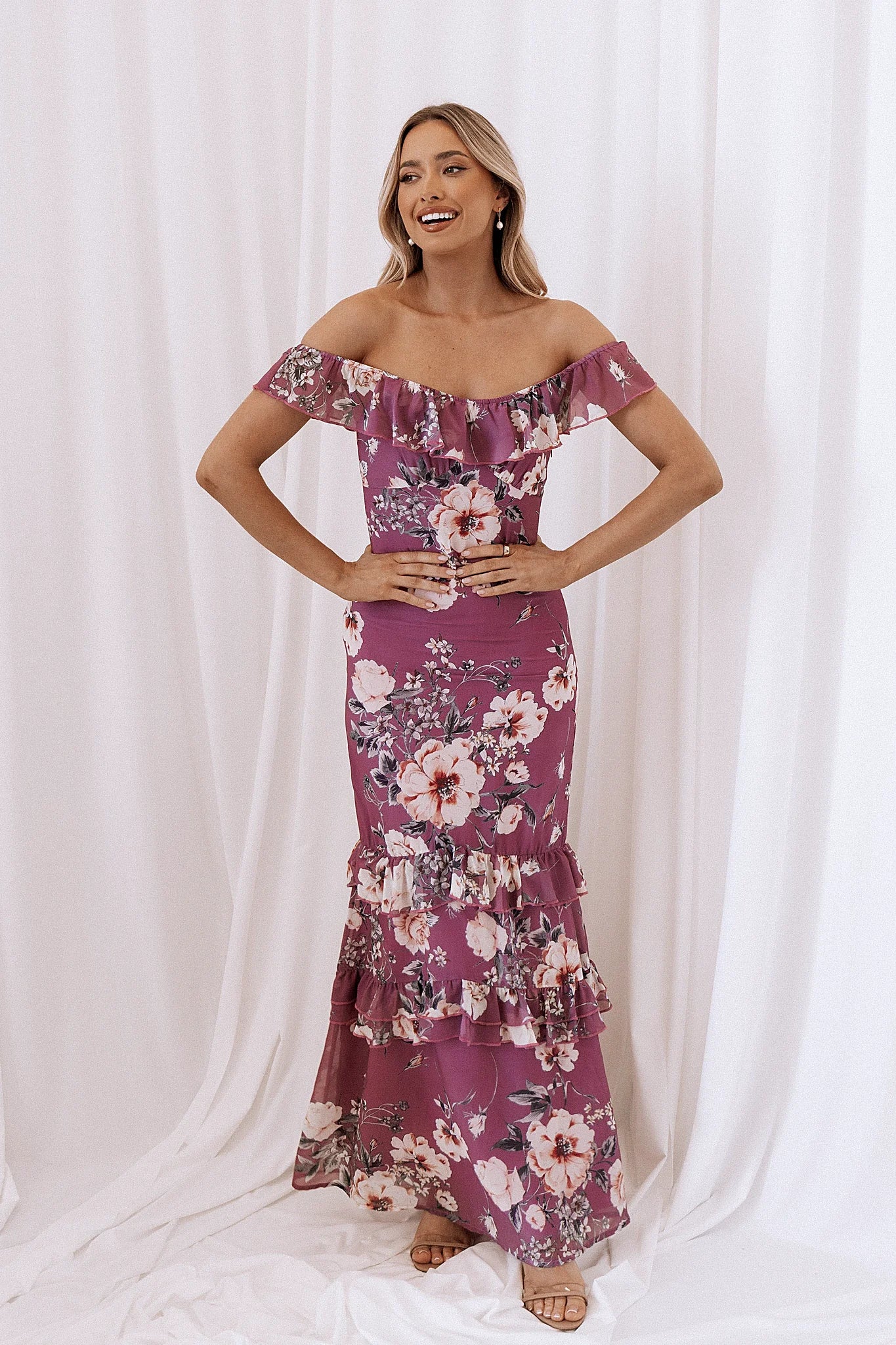 Front view of a floral maxi dress with a ruffled round neckline