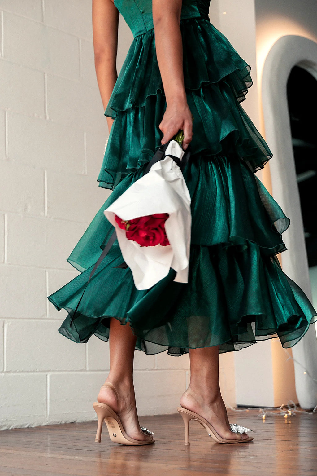 Side view showing the layered tiers of the plisse skirt