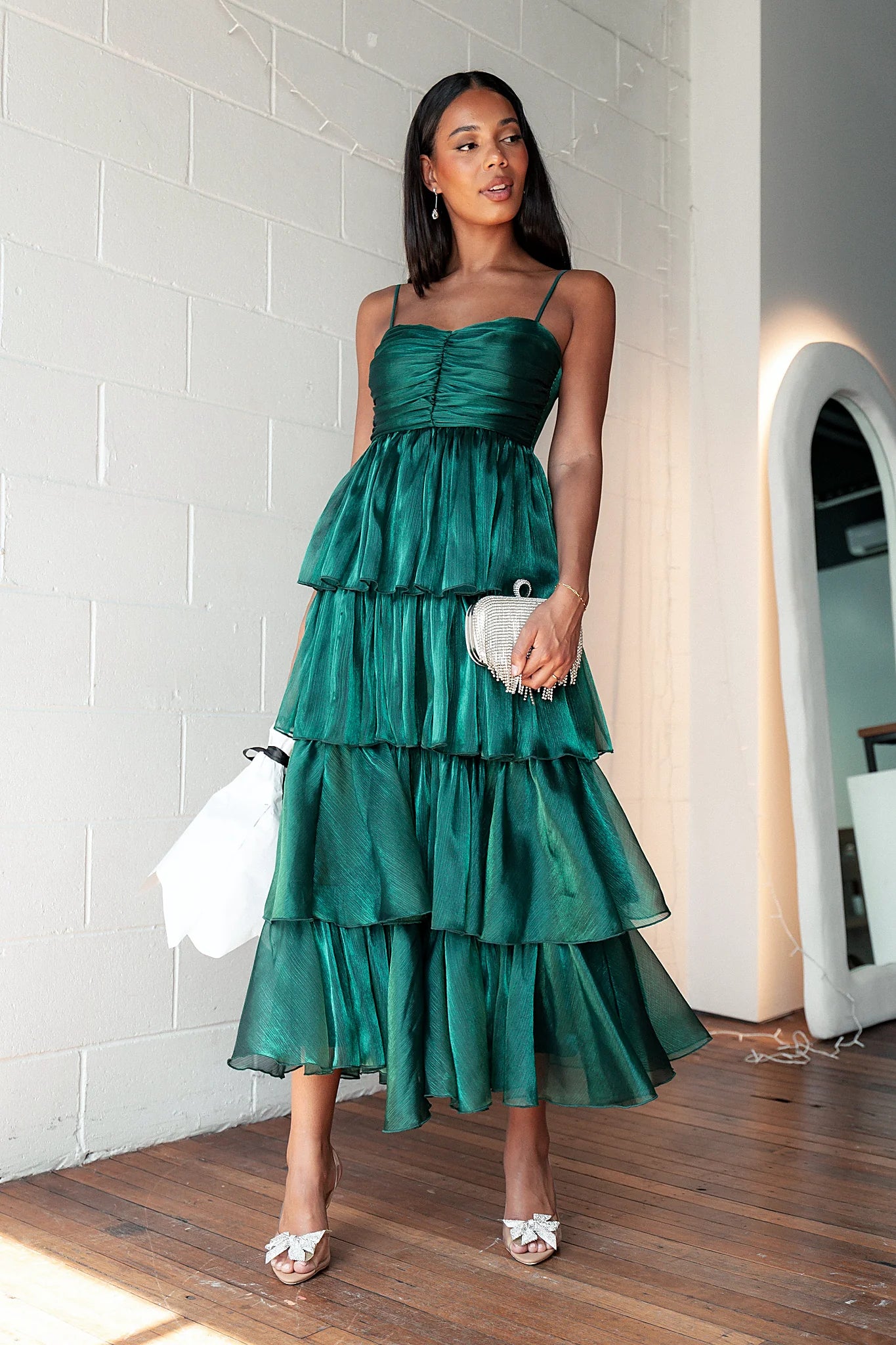 Front view of a green tiered maxi dress with a sweetheart neckline