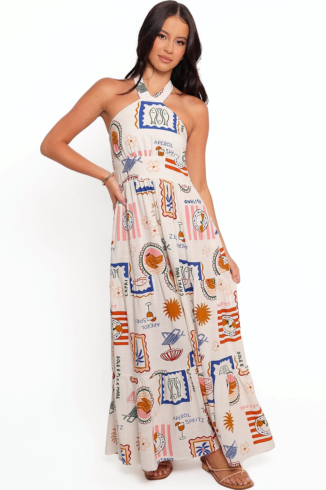 Front view of a tropical print maxi dress with a halter neckline