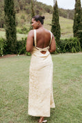 Front view of a sleeveless floral maxi dress with a round neckline