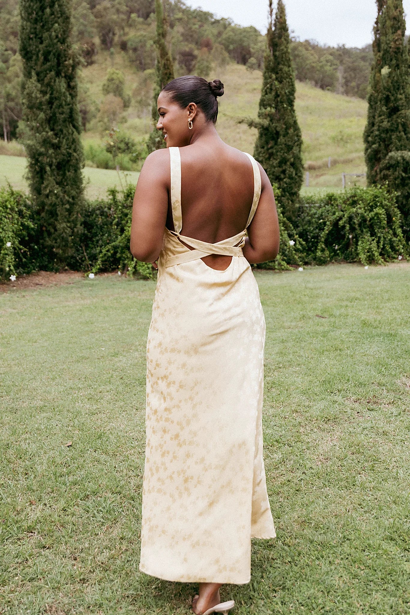 Front view of a sleeveless floral maxi dress with a round neckline