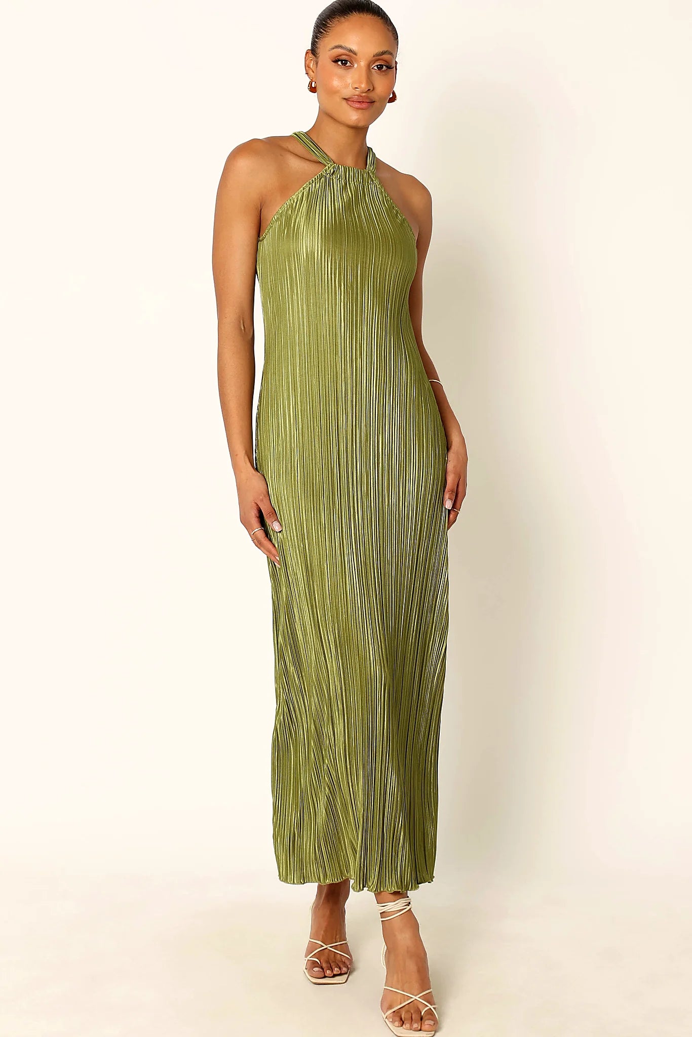 Front view of a green plisse maxi dress with a halter neckline