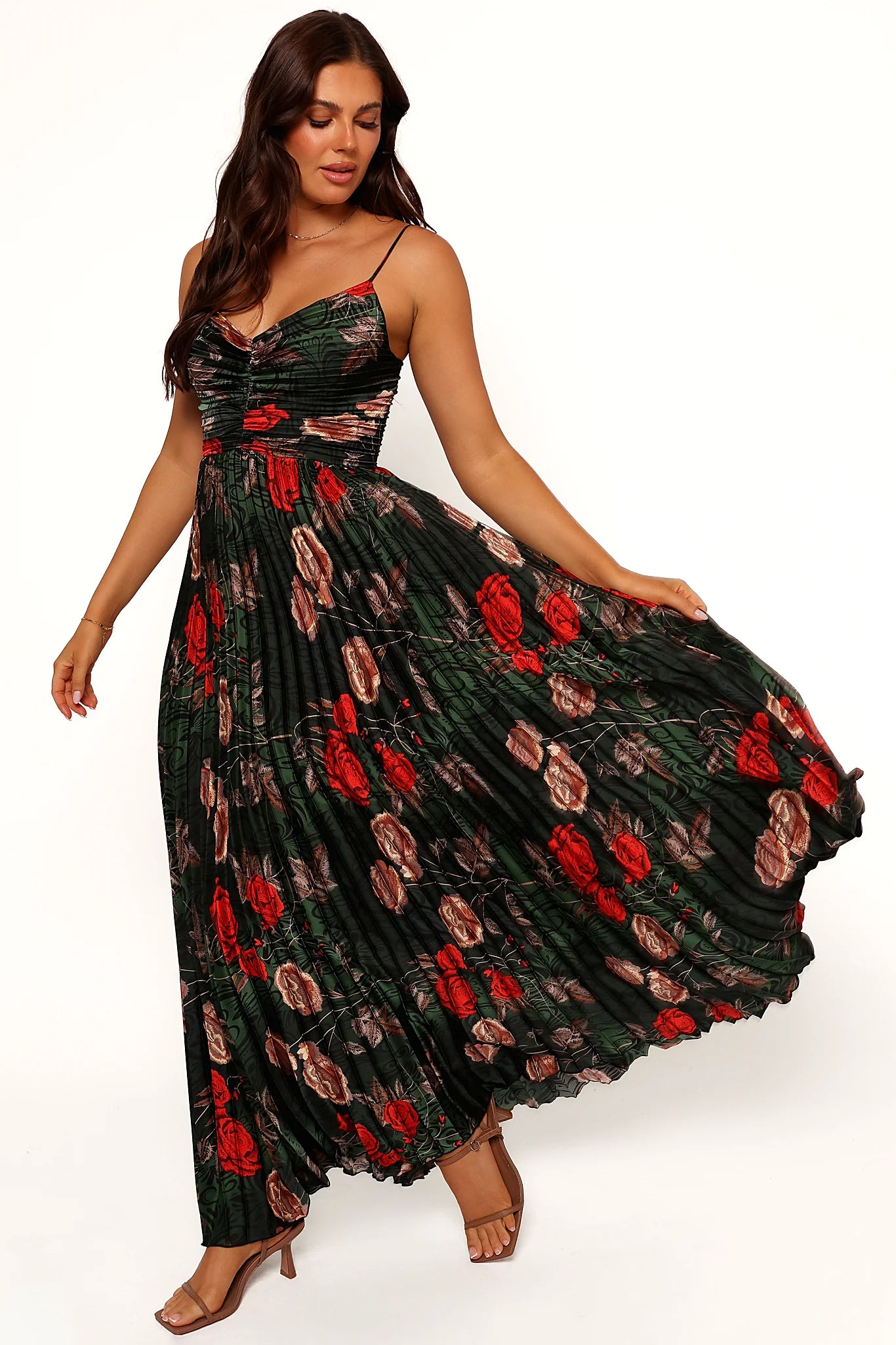 Front view of a green floral maxi dress in pleated satin