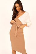 Front view of a two-tone knit midi dress with a V overlay neckline