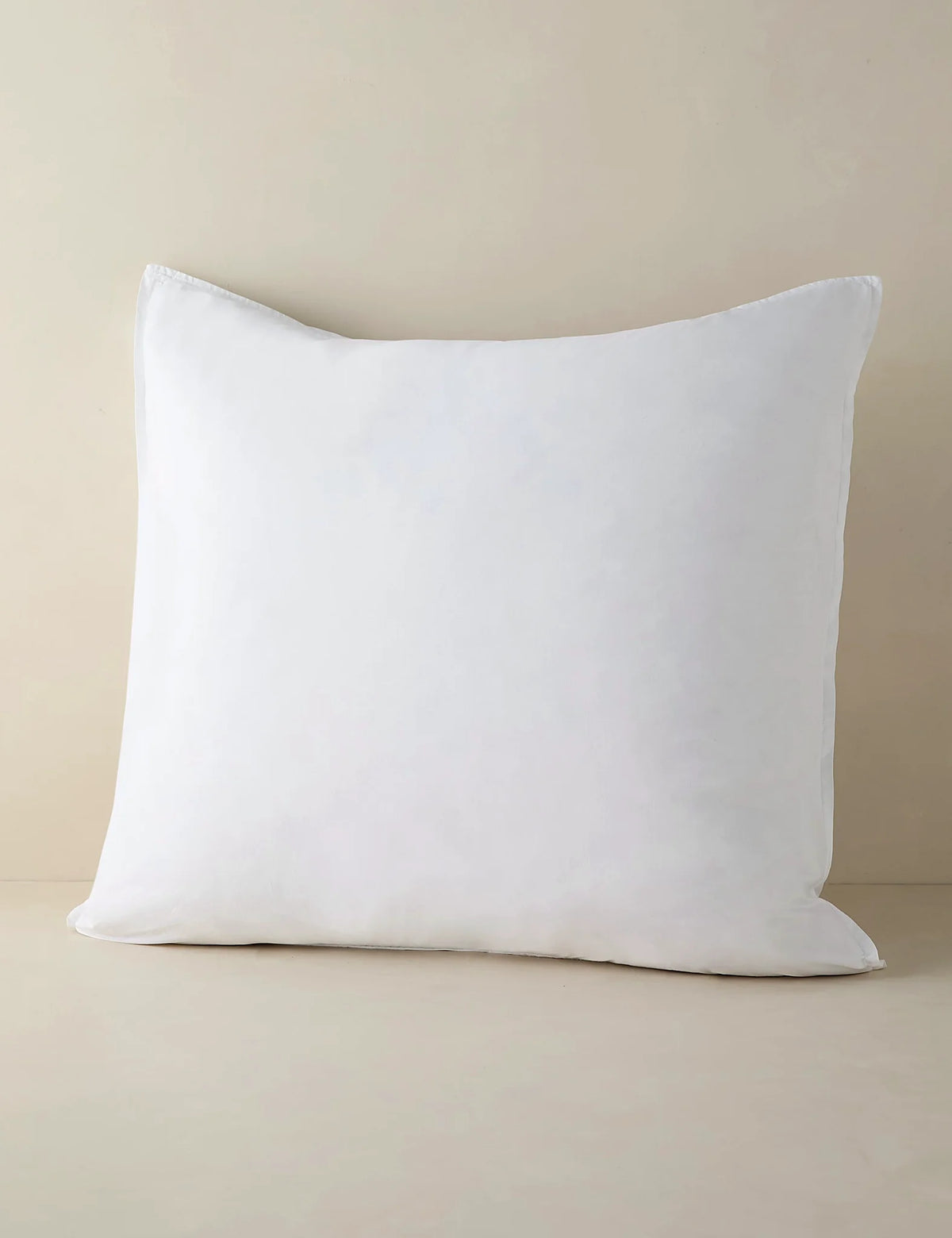 White percale sham in euro size photographed against a plain ground