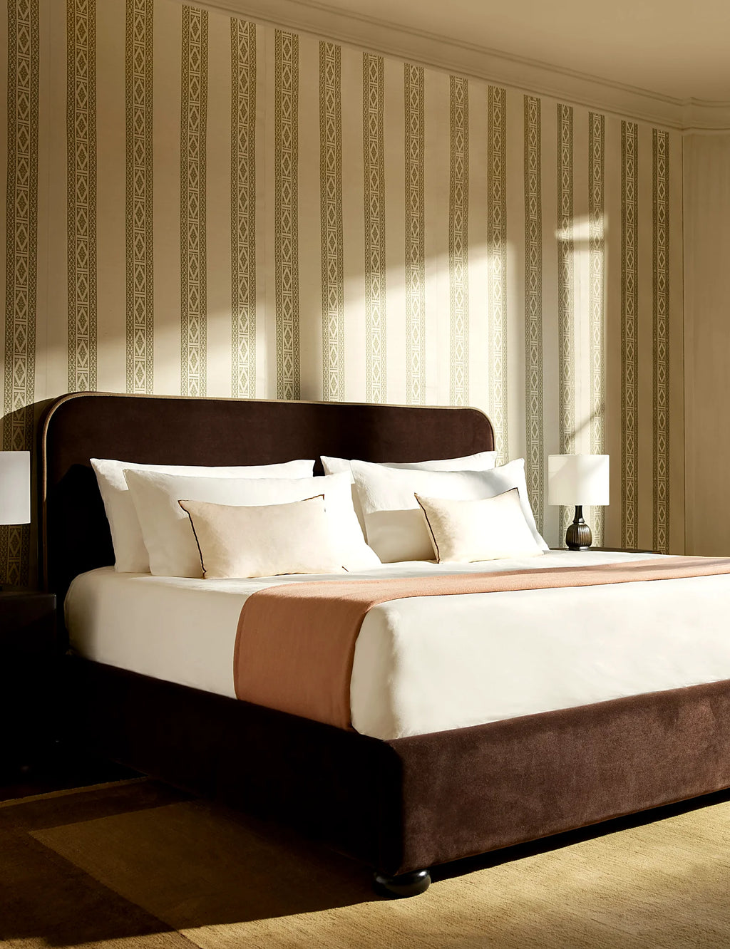 Fully styled bedroom with percale shams at the head of the bed