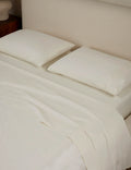Vanilla percale sheet set in full queen size photographed flat