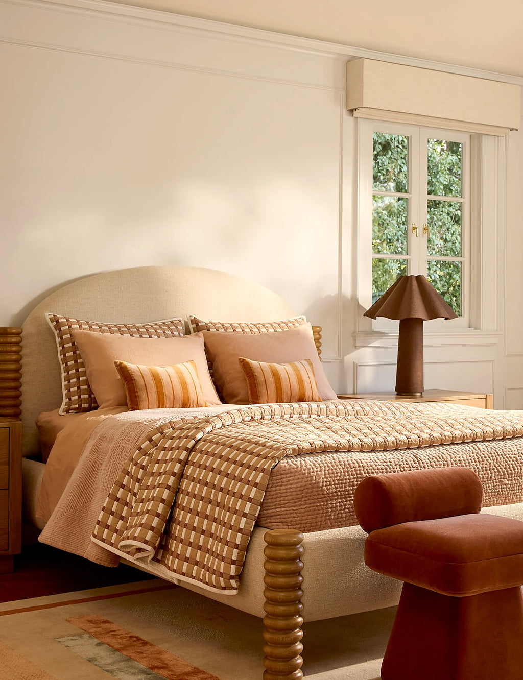 Bedroom with a plush velvet quilt folded across the foot of the bed