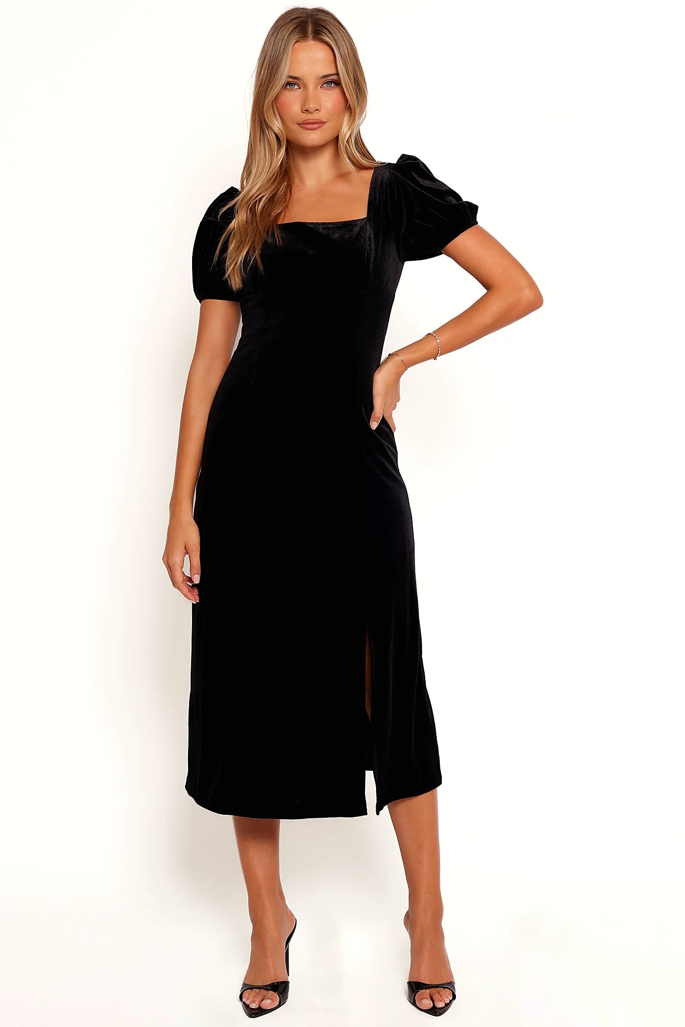 Front view of a black velvet midi dress with a square neckline