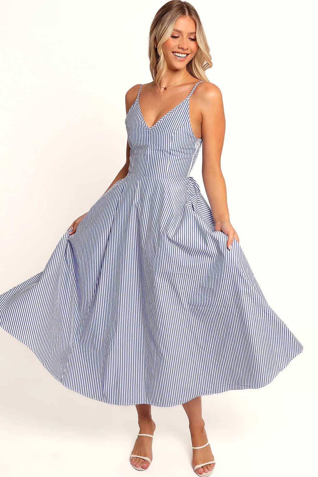 Side view of the dress falling loose to the floor