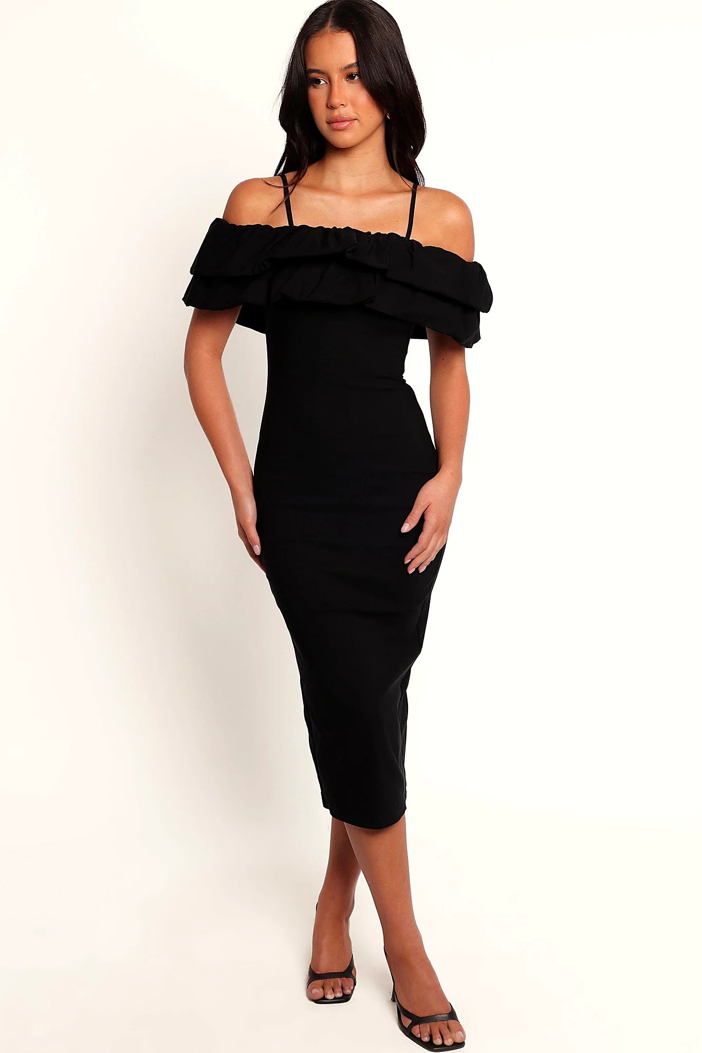Front view of a black off-shoulder midi dress with tiered ruffle trim