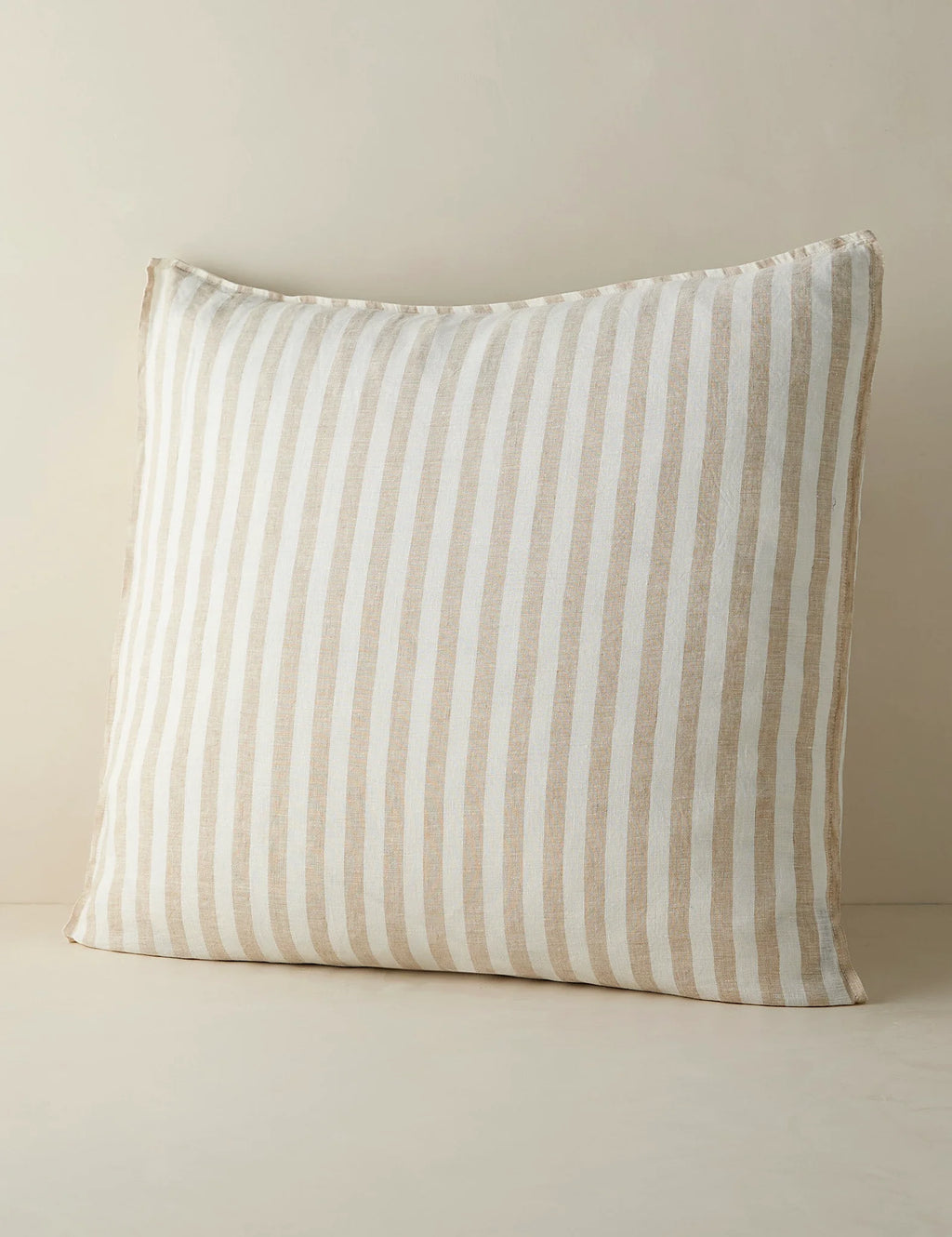 Euro size striped linen sham against a plain ground