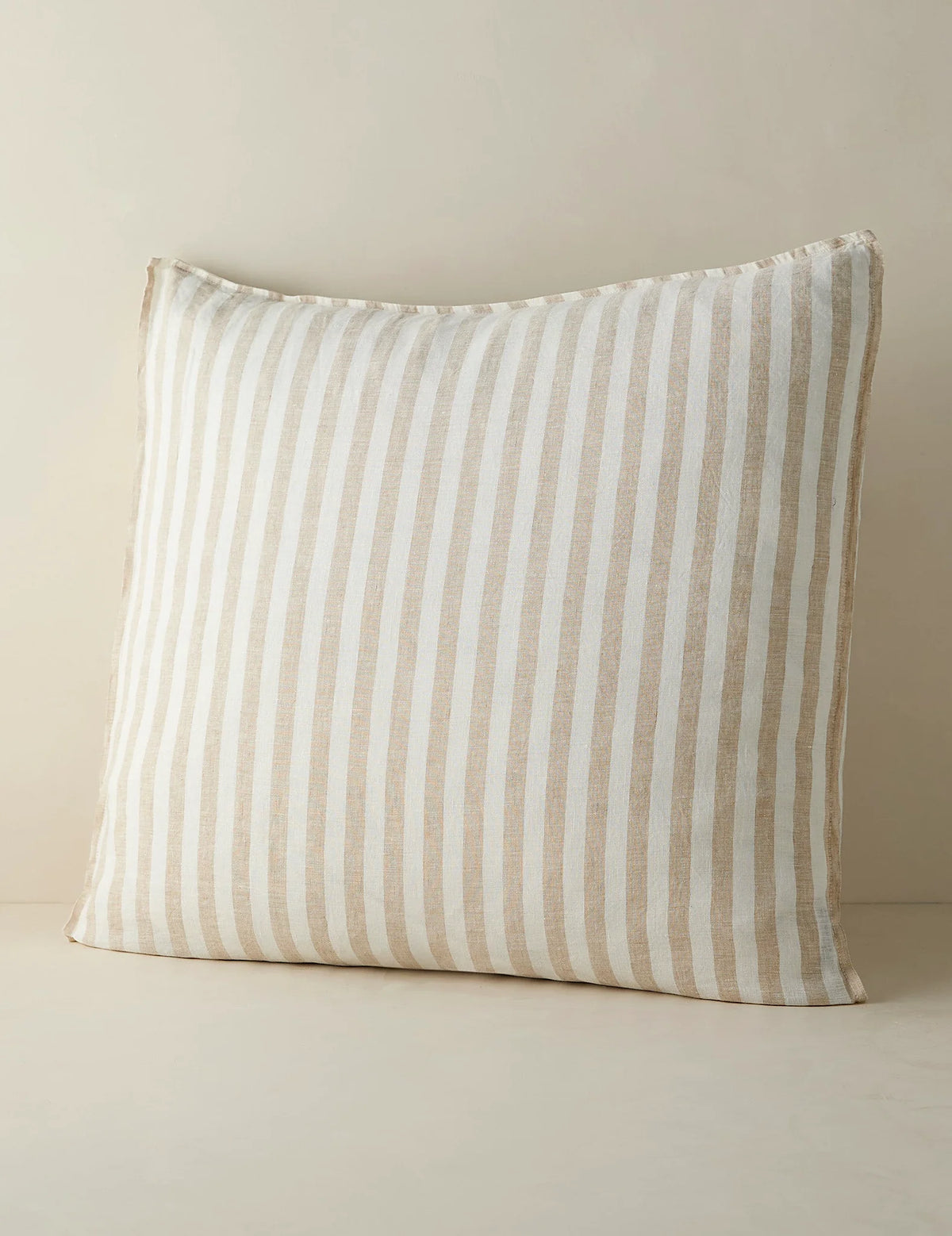 Euro size striped linen sham against a plain ground