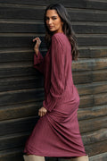 Front view of a wine plisse midi dress with long sleeves