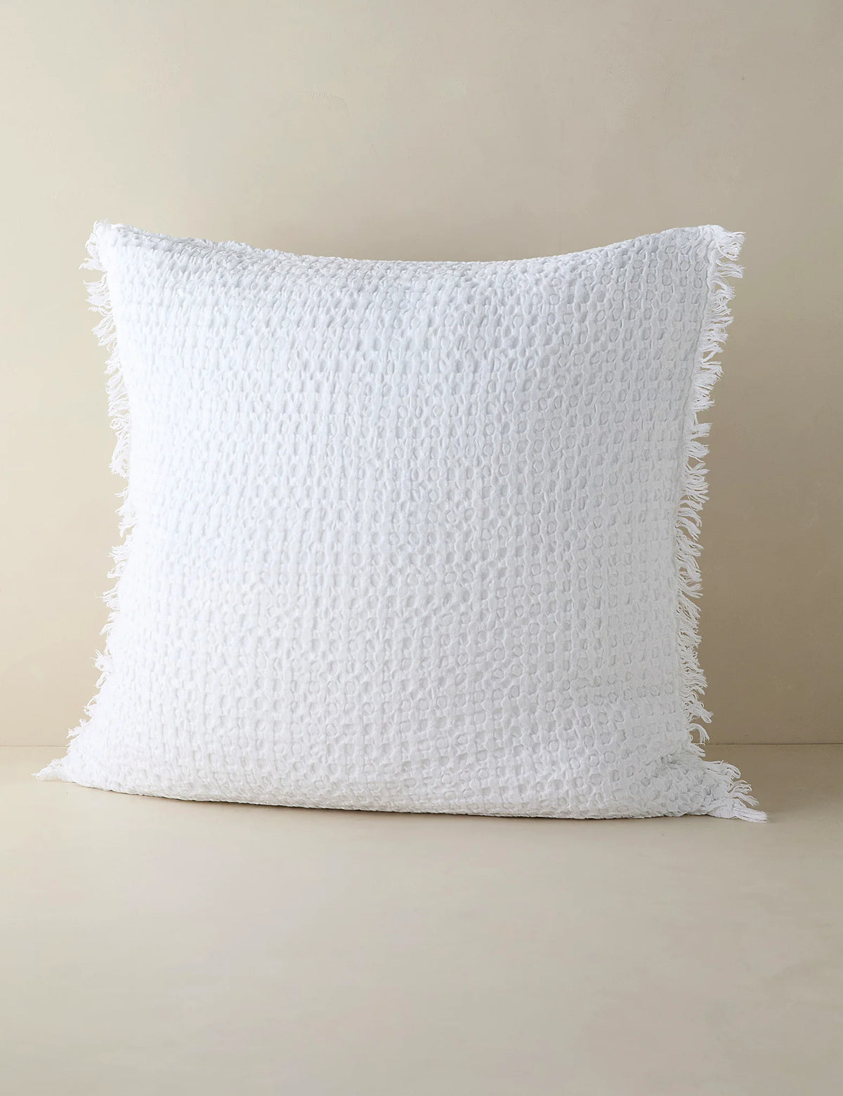 White textured sham in euro size shown against a plain ground