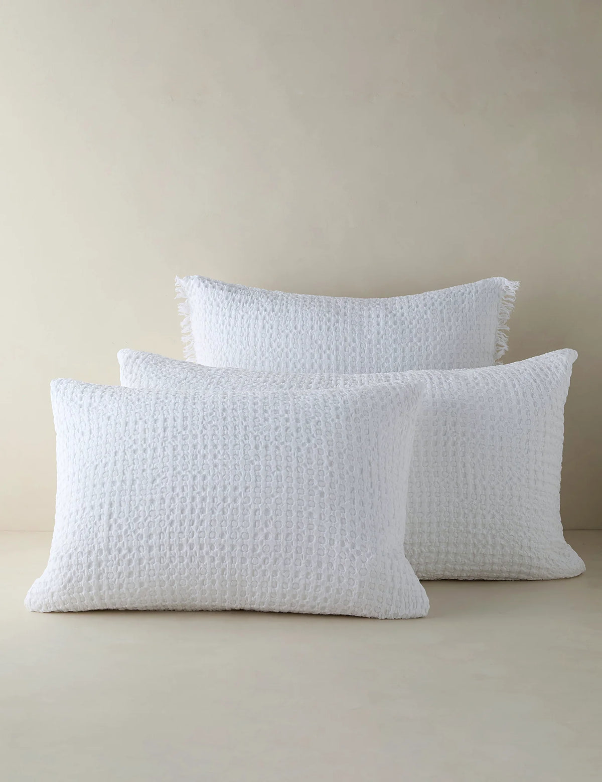 Group shot of textured cotton-linen shams in two sizes