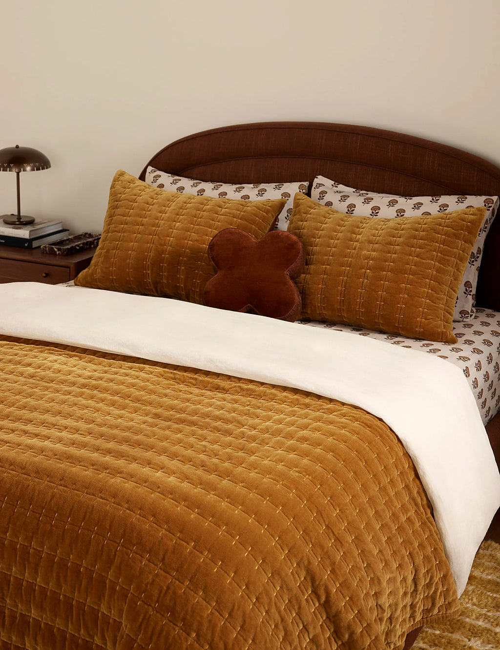 Marigold velvet quilt in full queen size on a made bed